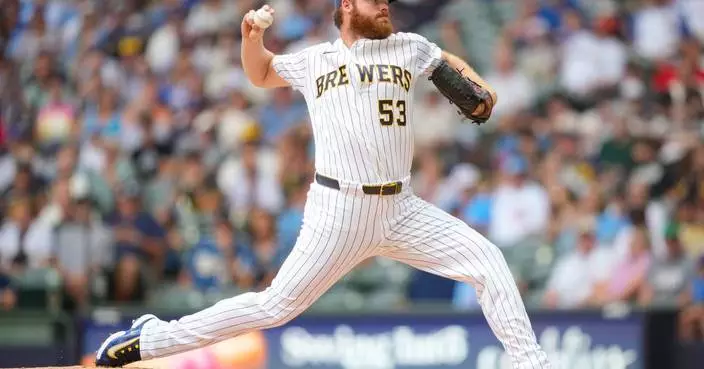 Milwaukee pitcher Brandon Woodruff isn't ruling out possible World Series return if Brewers make it