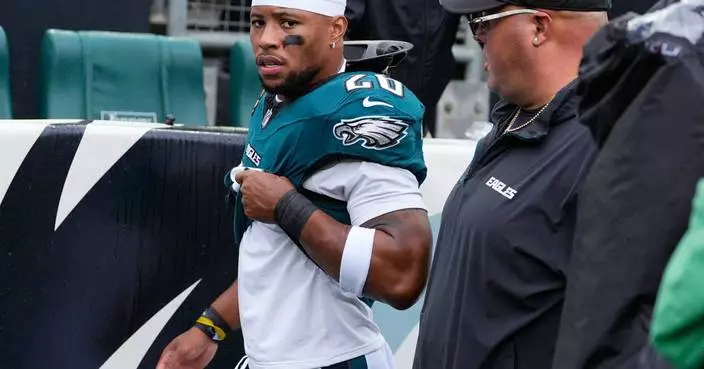 Eagles running back Saquon Barkley leaves game against Rams with apparent hamstring injury