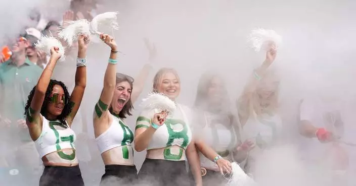 No. 1 Miami, in its first game atop AP poll since 2002 season, rolls past Pitt 52-23