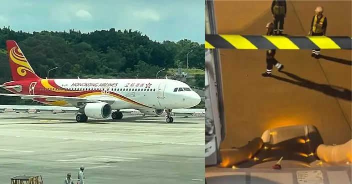 香港航空客機降落大阪機場後 其中一道緊急逃生門打開並彈出逃生梯