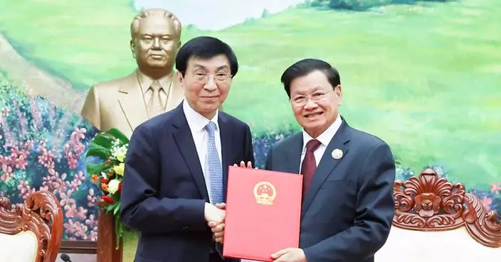 王滬寧率團正式友好訪問老撾　與老撾國家主席通倫會談