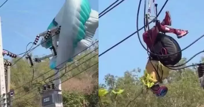 美遊客赴泰玩滑翔傘受困高壓電線桿 當局停電近1小時救援助安全脫險