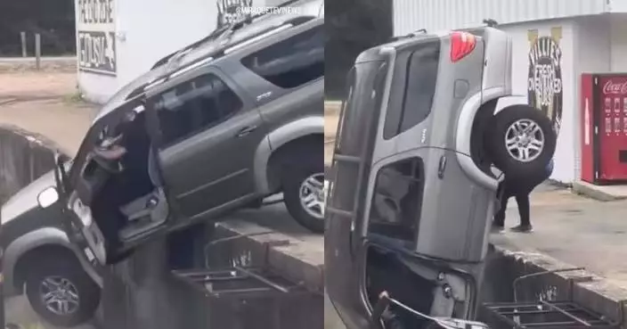 美休旅車懸停車場邊緣 獲兩男施救中突失衡翻落溝渠 司機涉酒駕被捕
