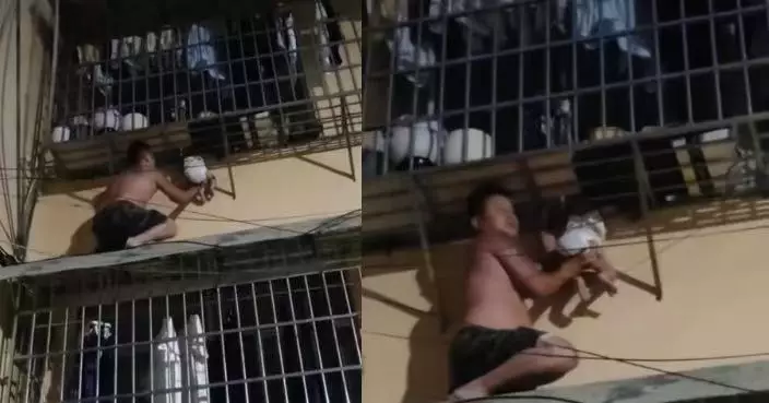 目擊幼童頭卡防盜網懸半空 貴州畏高男赤膊徒手爬樓托舉8分鐘助化險為夷